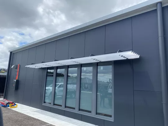 Sun Louvres in an eyebrown configuration bringing form and function. By Louvretec Tasmania